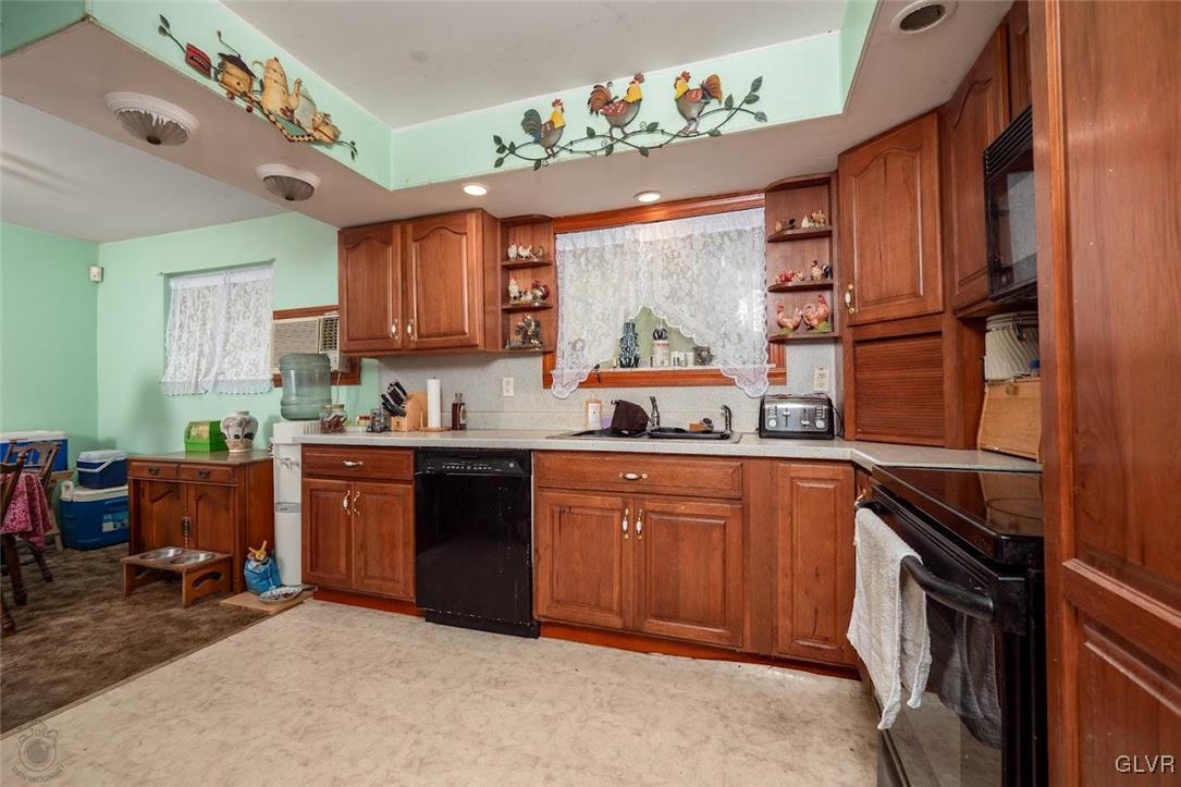 504 Heyer Mill Road Nazareth, PA 18064 - Photo 3 of 26 a kitchen with kitchen island granite countertop a sink window and cabinets