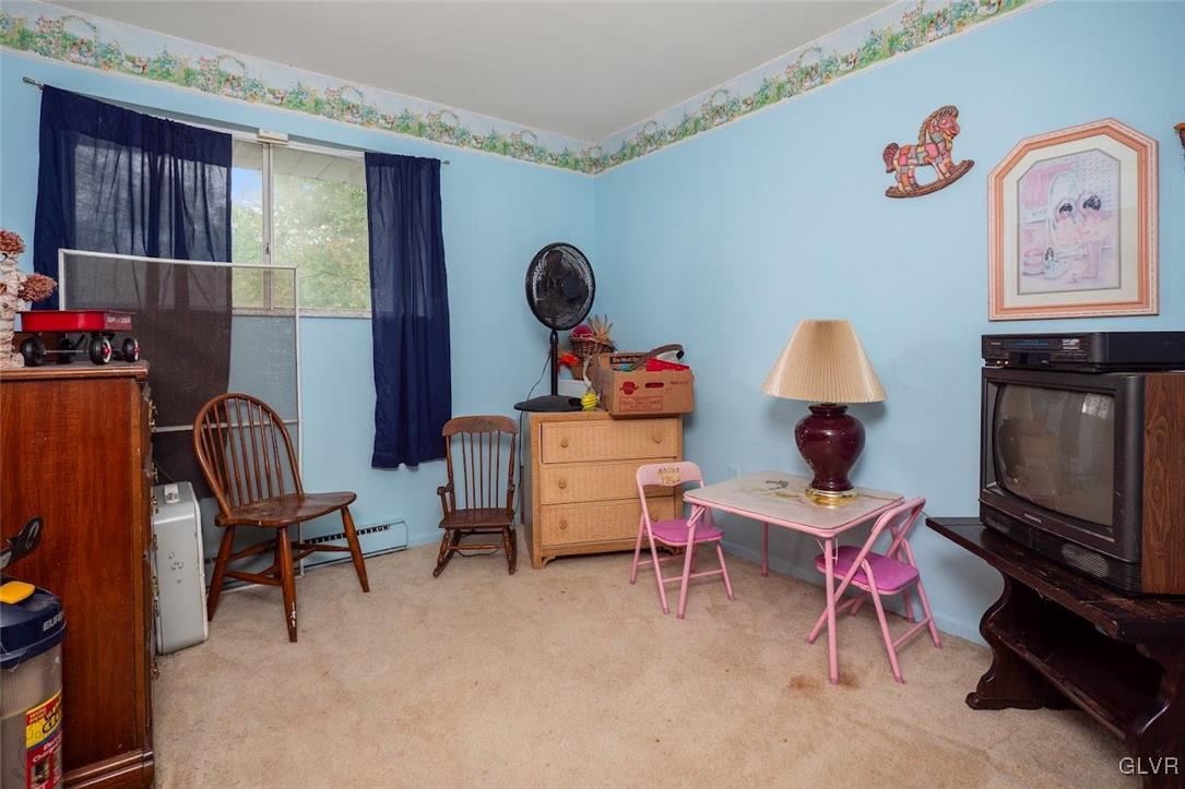 504 Heyer Mill Road Nazareth, PA 18064 - Photo 8 of 26 a living room with furniture and a flat screen tv