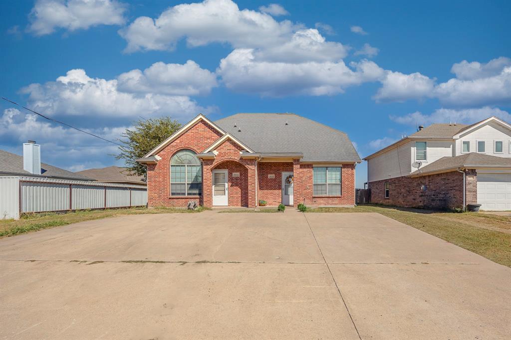 103 Janis Street, Unit B Alvarado, TX 76009 - Photo 24 of 35 a view of a house with a yard