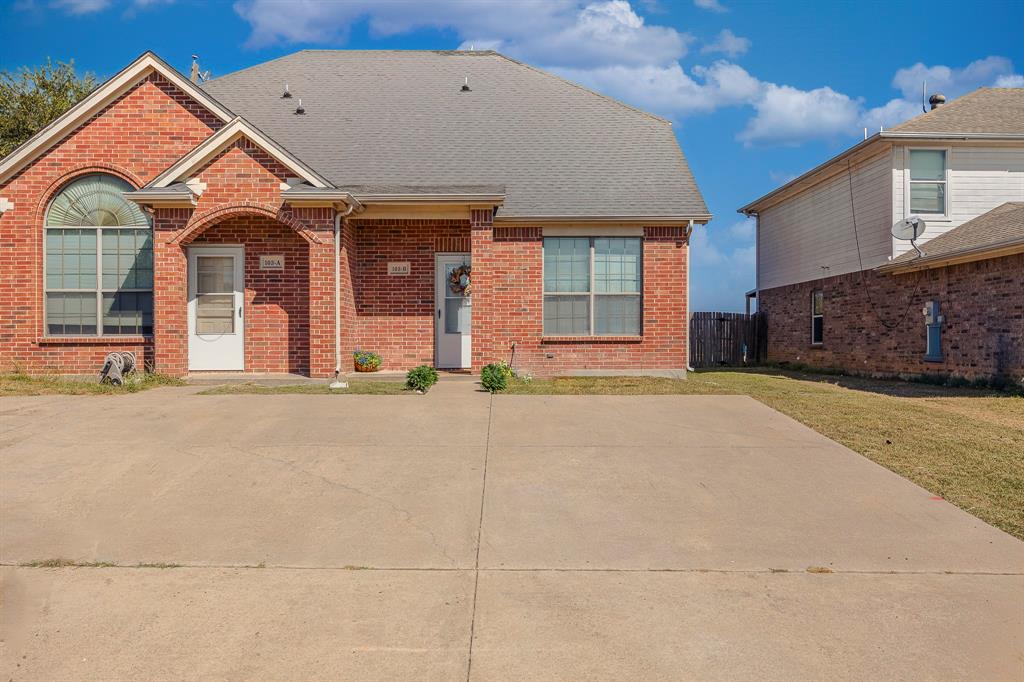 103 Janis Street, Unit B Alvarado, TX 76009 - Photo 25 of 35 a front view of a house with a yard