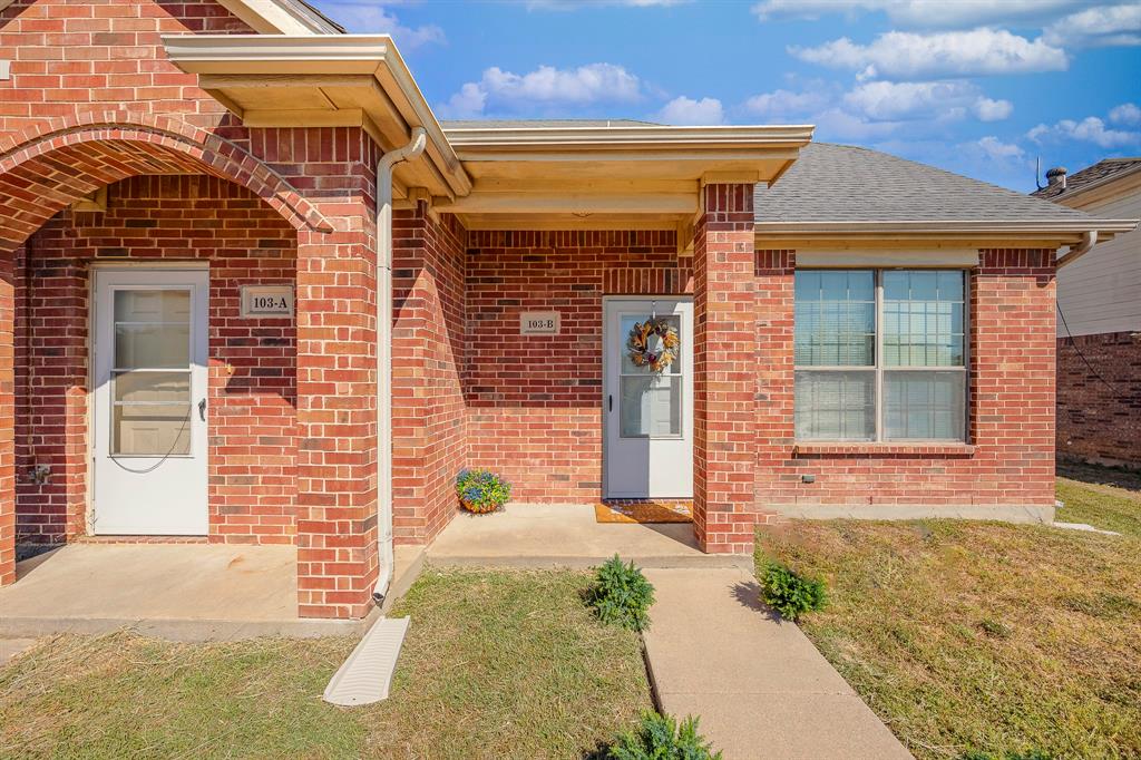 103 Janis Street, Unit B Alvarado, TX 76009 - Photo 27 of 35 a front view of a house with a yard