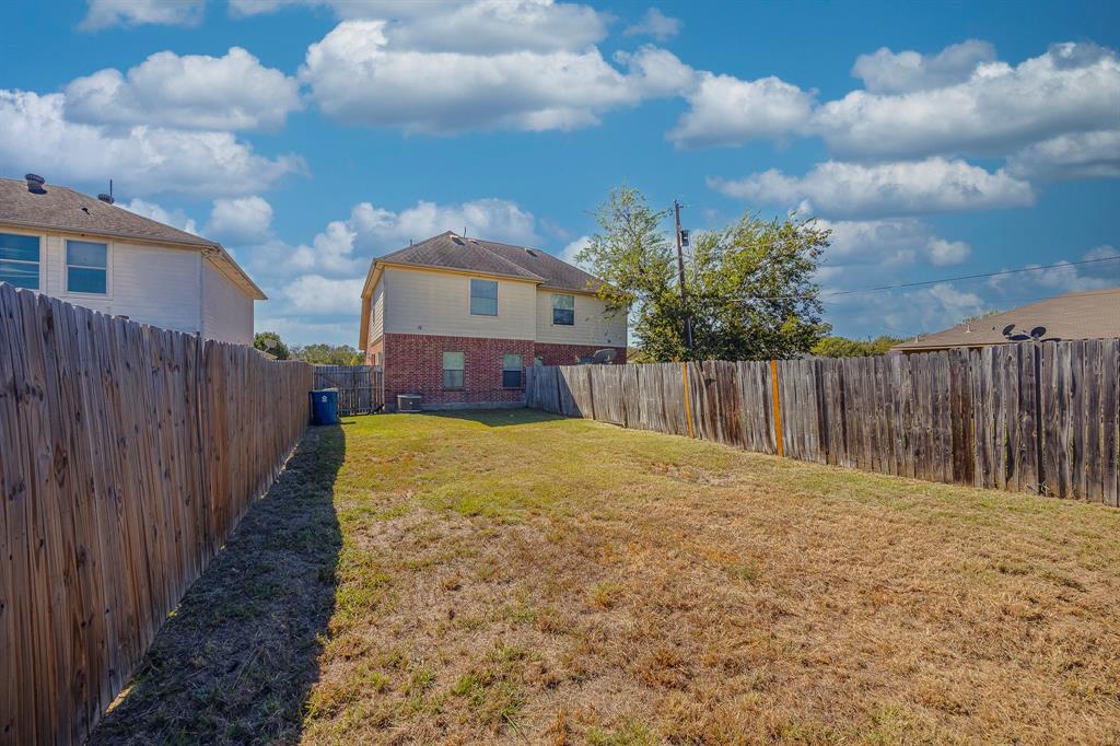 103 Janis Street, Unit B Alvarado, TX 76009 - Photo 28 of 35 a swimming pool with wooden fence