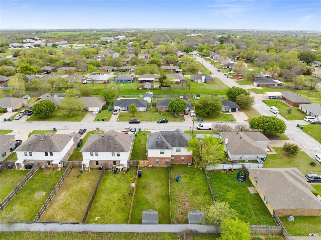 103 Janis Street, Unit B Alvarado, TX 76009 - Photo 33 of 35 an aerial view of residential houses with outdoor space