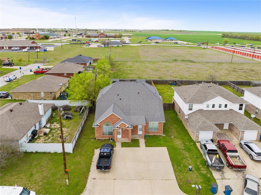 103 Janis Street, Unit B Alvarado, TX 76009 - Photo 34 of 35 an aerial view of a house with a garden and lake view