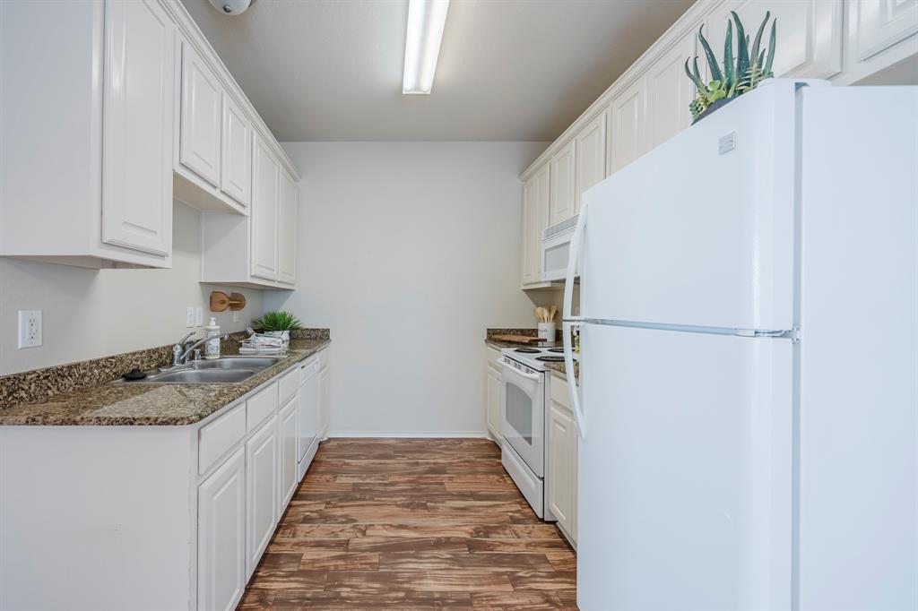 103 Janis Street, Unit B Alvarado, TX 76009 - Photo 6 of 35 a kitchen with a sink stove and refrigerator