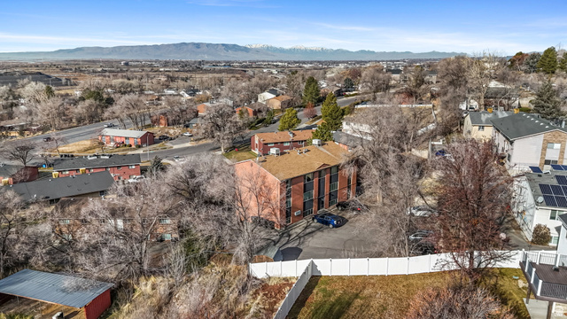 2030 Nevada Circle Provo, UT 84606 - Photo 3 of 16 Aerial view of residential area with a mountain backdrop