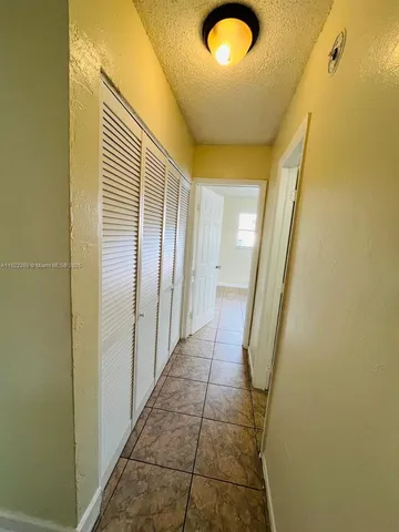 a bathroom with a sink a toilet a mirror and vanity