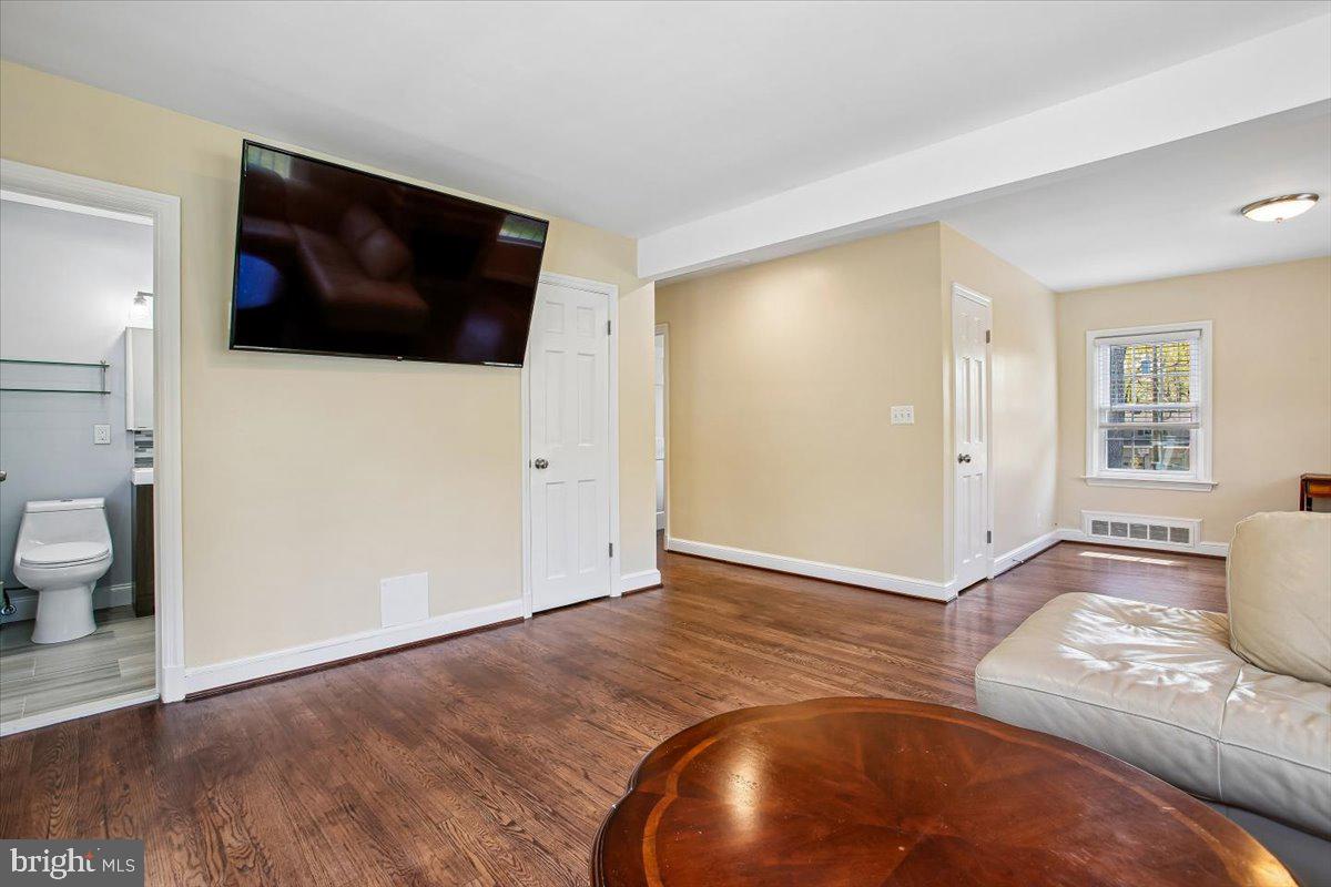 1305 Key Drive Alexandria, VA 22302 - Photo 14 of 64 a view of a livingroom with wooden floor and flat screen tv