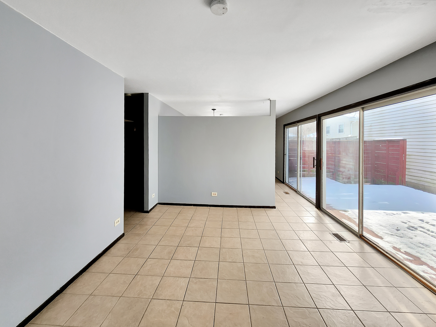 256 Waverly Drive Elgin, IL 60120 - Photo 2 of 6 a view of an empty room and window