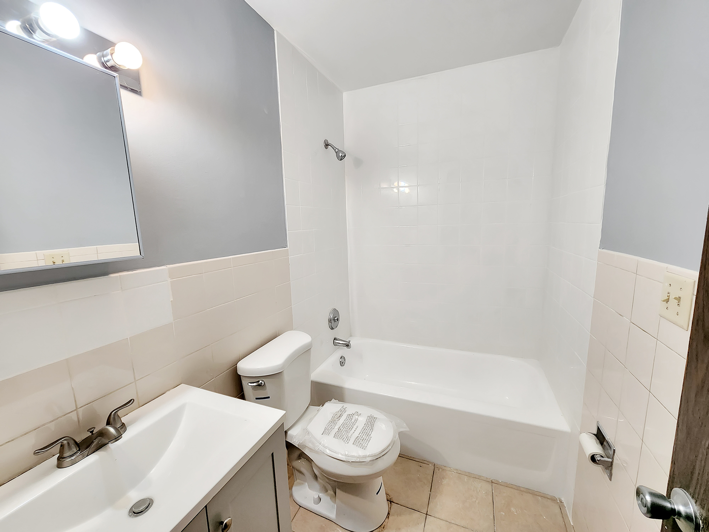 256 Waverly Drive Elgin, IL 60120 - Photo 6 of 6 a bathroom with a sink a toilet and a bathtub