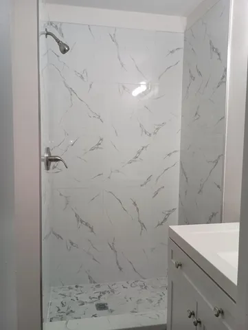 a bathroom with a sink a vanity and a mirror