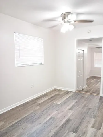 a bathroom with a sink toilet and a mirror