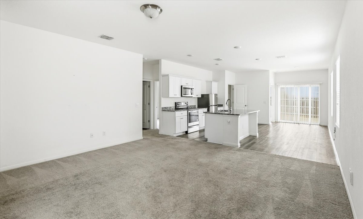 202 Peridot Pass Maxwell, TX 78656 - Photo 20 of 21 An open concept floorplan seamlessly connects the living area with a contemporary kitchen, perfect for everyday living.