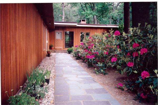 75 Woodside Road Harvard, MA 01451 - Photo 2 of 30 a view of lot of flowers in front of a door