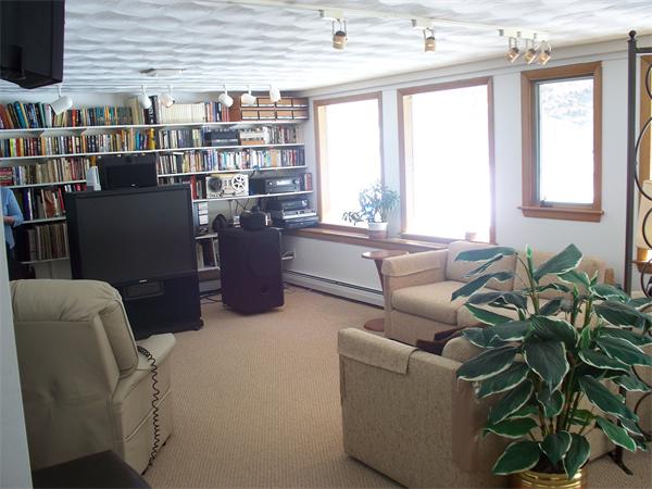 75 Woodside Road Harvard, MA 01451 - Photo 25 of 30 a living room with furniture and a potted plant