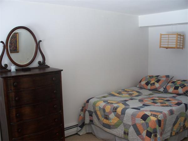 75 Woodside Road Harvard, MA 01451 - Photo 29 of 30 a bedroom with a bed and a dresser