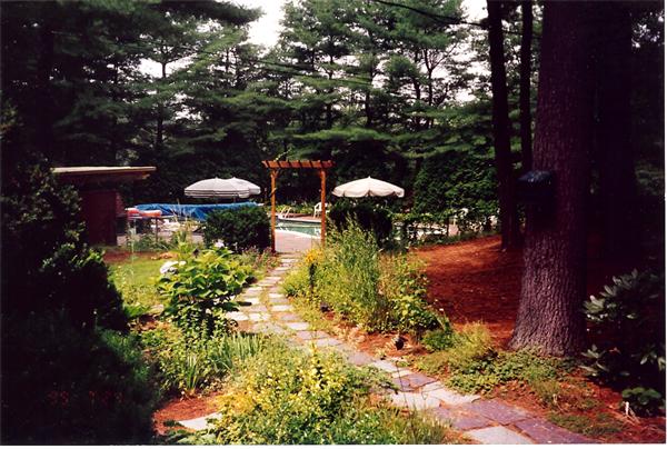75 Woodside Road Harvard, MA 01451 - Photo 4 of 30 a view of a back yard of the house and a fountain