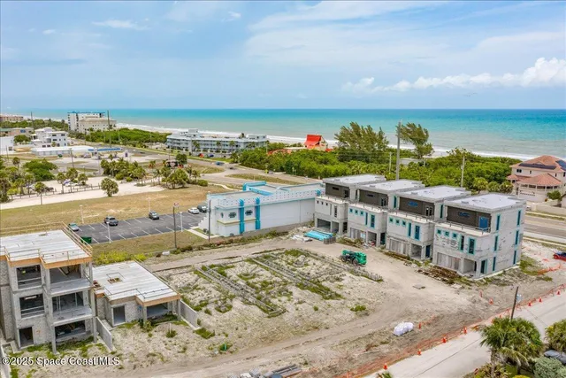 a view of a city with an ocean view