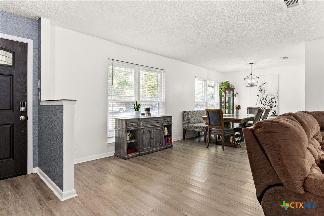 4117 Antelope Trail Temple, TX 76504 - Photo 4 of 30 a living room with furniture and a wooden floor