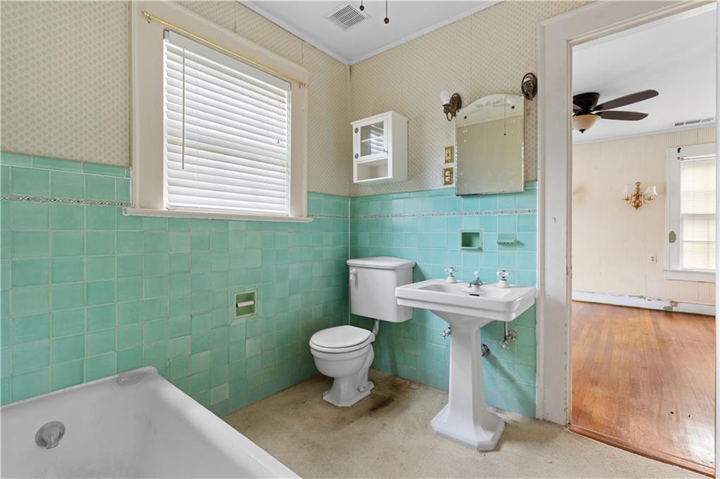 1080 East Clifton Road Northeast Atlanta, GA 30307 - Photo 18 of 29 a bathroom with a sink toilet and shower