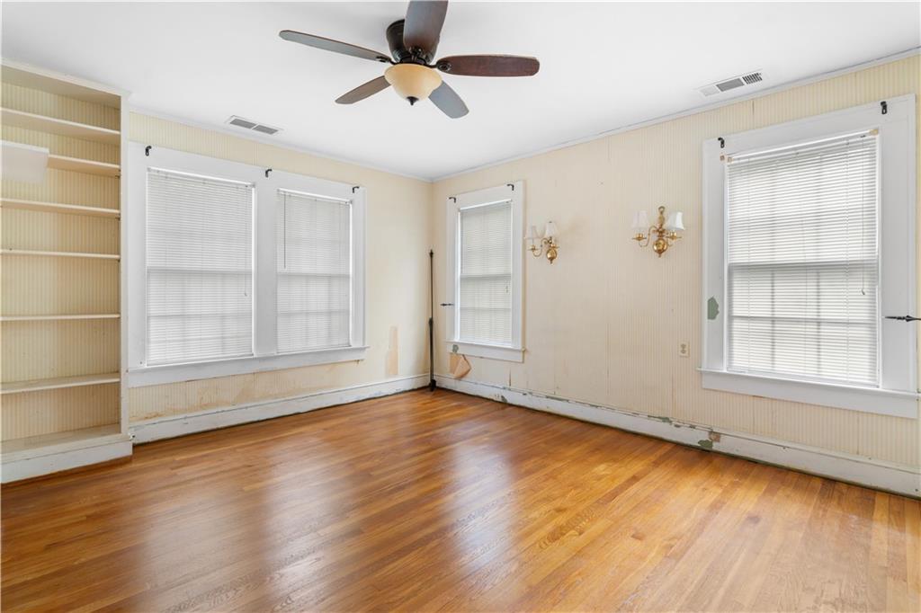 1080 East Clifton Road Northeast Atlanta, GA 30307 - Photo 20 of 29 wooden floor in an empty room with a window