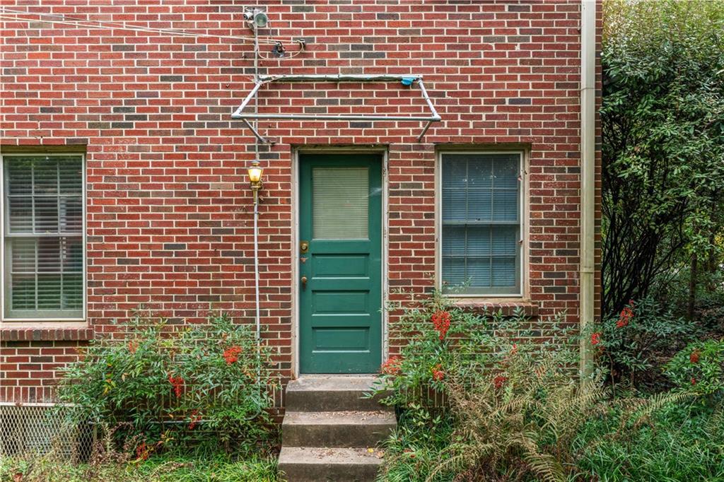 1080 East Clifton Road Northeast Atlanta, GA 30307 - Photo 27 of 29 a front view of a house with plants