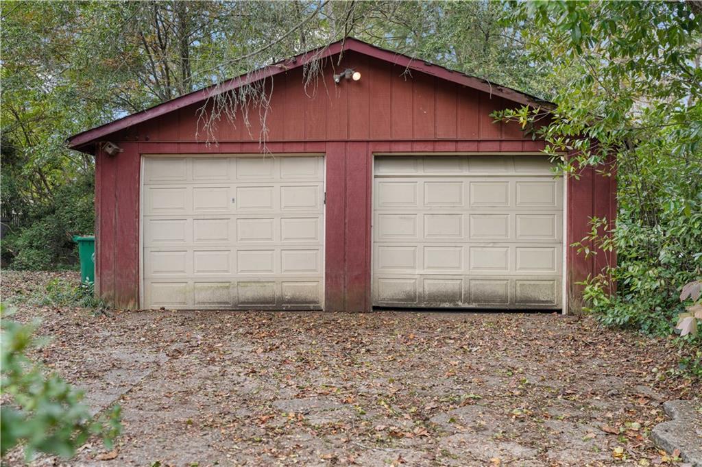 1080 East Clifton Road Northeast Atlanta, GA 30307 - Photo 28 of 29 a front view of a house with garage