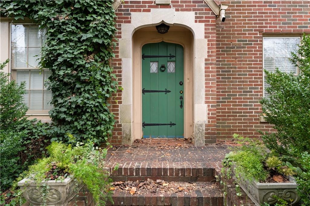1080 East Clifton Road Northeast Atlanta, GA 30307 - Photo 6 of 29 a front view of a house with a garden