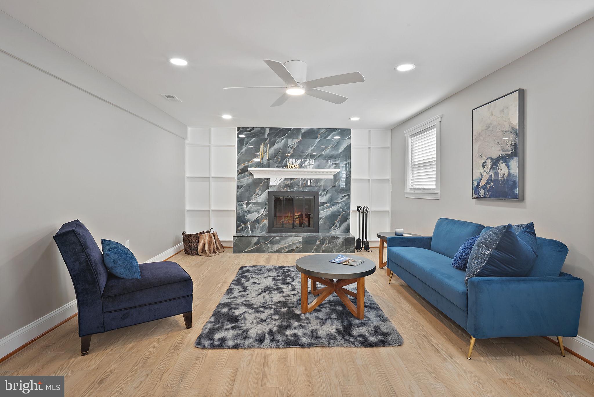 18901 Bloomfield Road Olney, MD 20832 - Photo 27 of 44 Lower level cozy fireplace