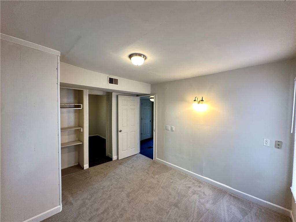 114 South Street Butler, PA 16001 - Photo 25 of 32 an empty room with closet and wooden door