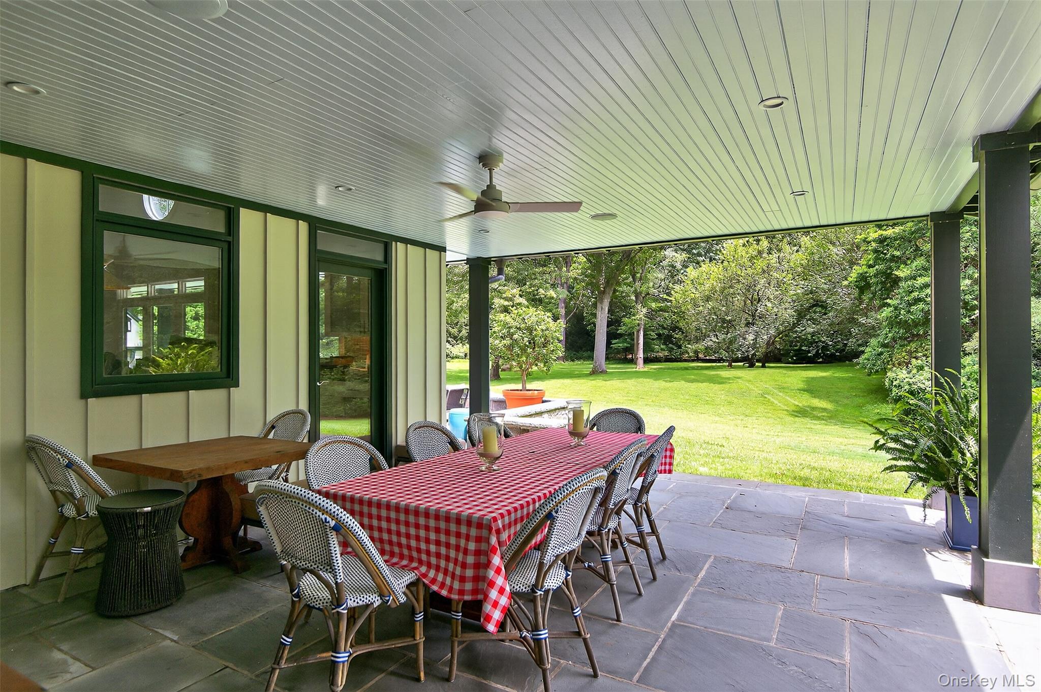 343 Chicken Valley Road Glen Head, NY 11545 - Photo 32 of 49 a patio with yard table and chairs