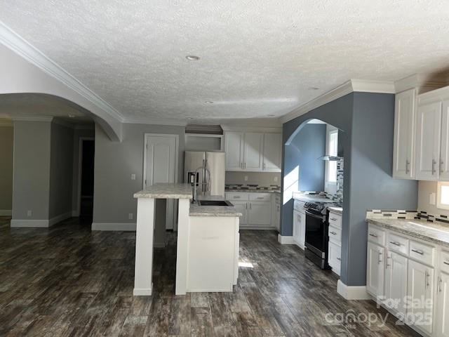 4832 Windy Ridge Road, Unit 2 Morganton, NC 28655 - Photo 12 of 41 a kitchen with stainless steel appliances kitchen island granite countertop a refrigerator stove and sink