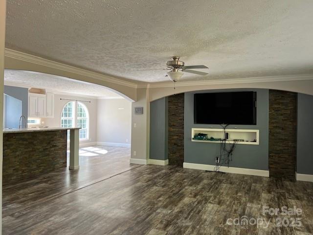 4832 Windy Ridge Road, Unit 2 Morganton, NC 28655 - Photo 18 of 41 a view of a livingroom with a flat screen tv wooden floor and a ceiling fan
