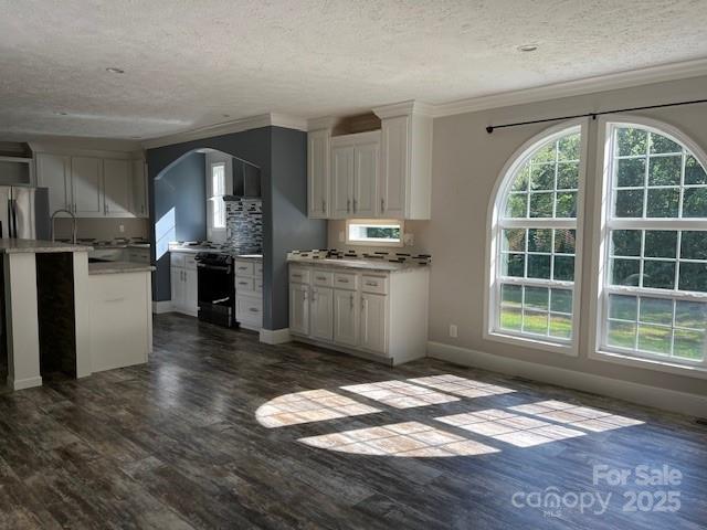 4832 Windy Ridge Road, Unit 2 Morganton, NC 28655 - Photo 6 of 41 a kitchen with granite countertop wooden floors and stainless steel appliances