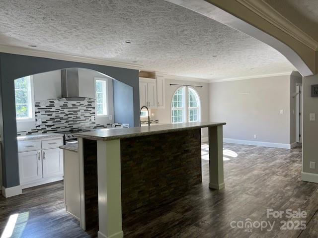 4832 Windy Ridge Road, Unit 2 Morganton, NC 28655 - Photo 7 of 41 a kitchen with kitchen island granite countertop a sink cabinets and wooden floor