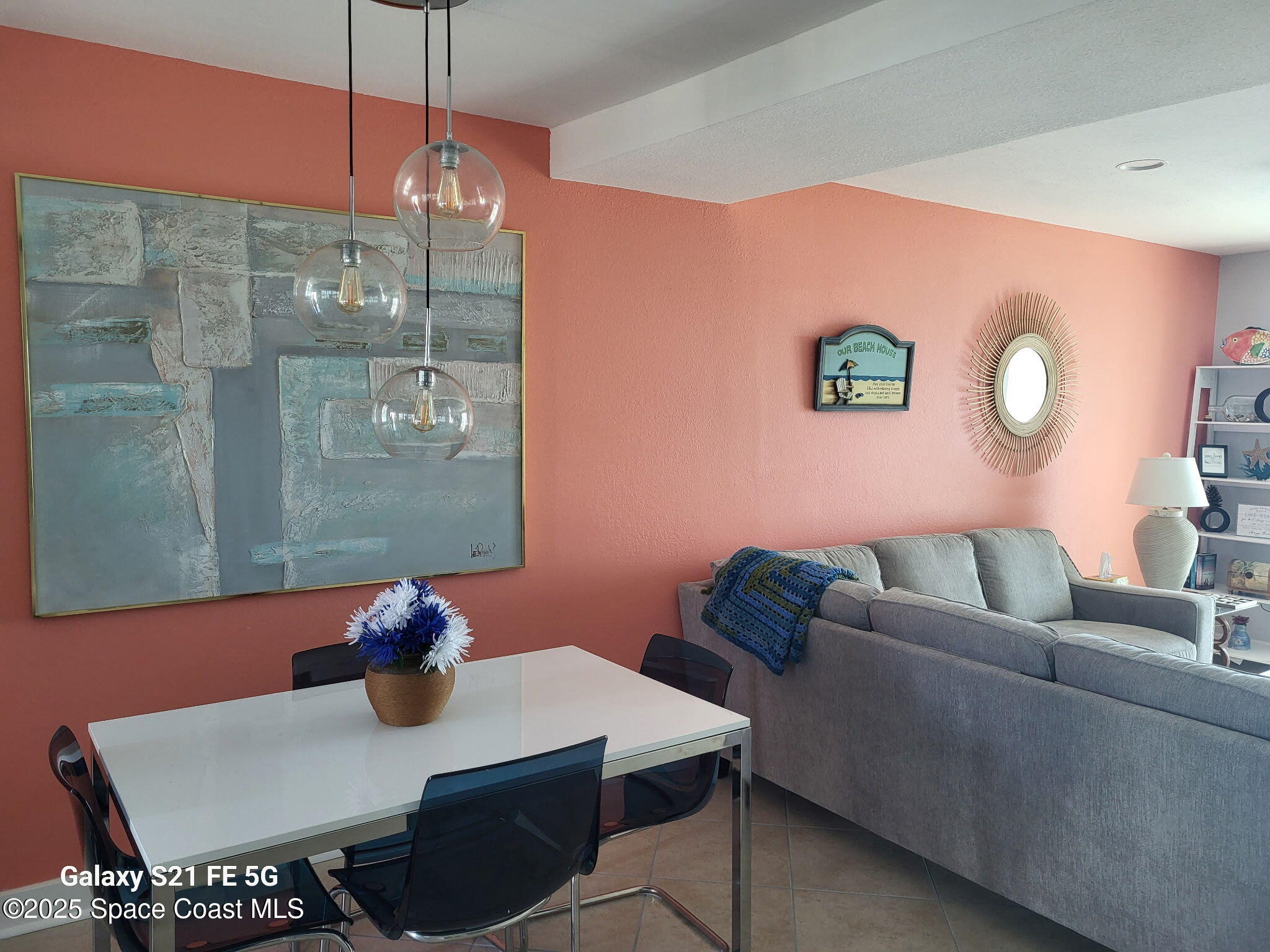 4000 Ocean Beach Boulevard, Unit 4F Cocoa Beach, FL 32931 - Photo 2 of 12 a living room with furniture and wooden floor