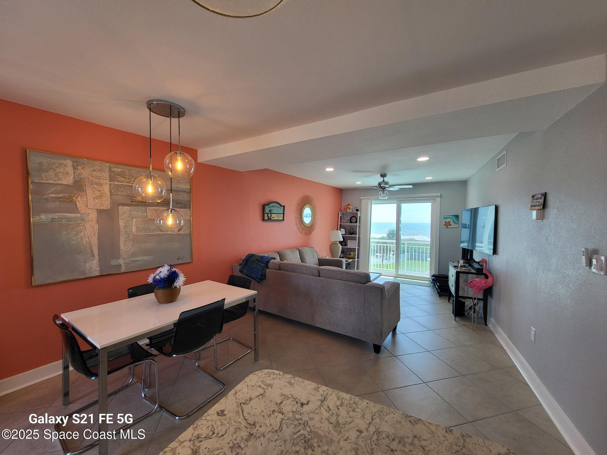 4000 Ocean Beach Boulevard, Unit 4F Cocoa Beach, FL 32931 - Photo 6 of 12 a living room with furniture and wooden floor