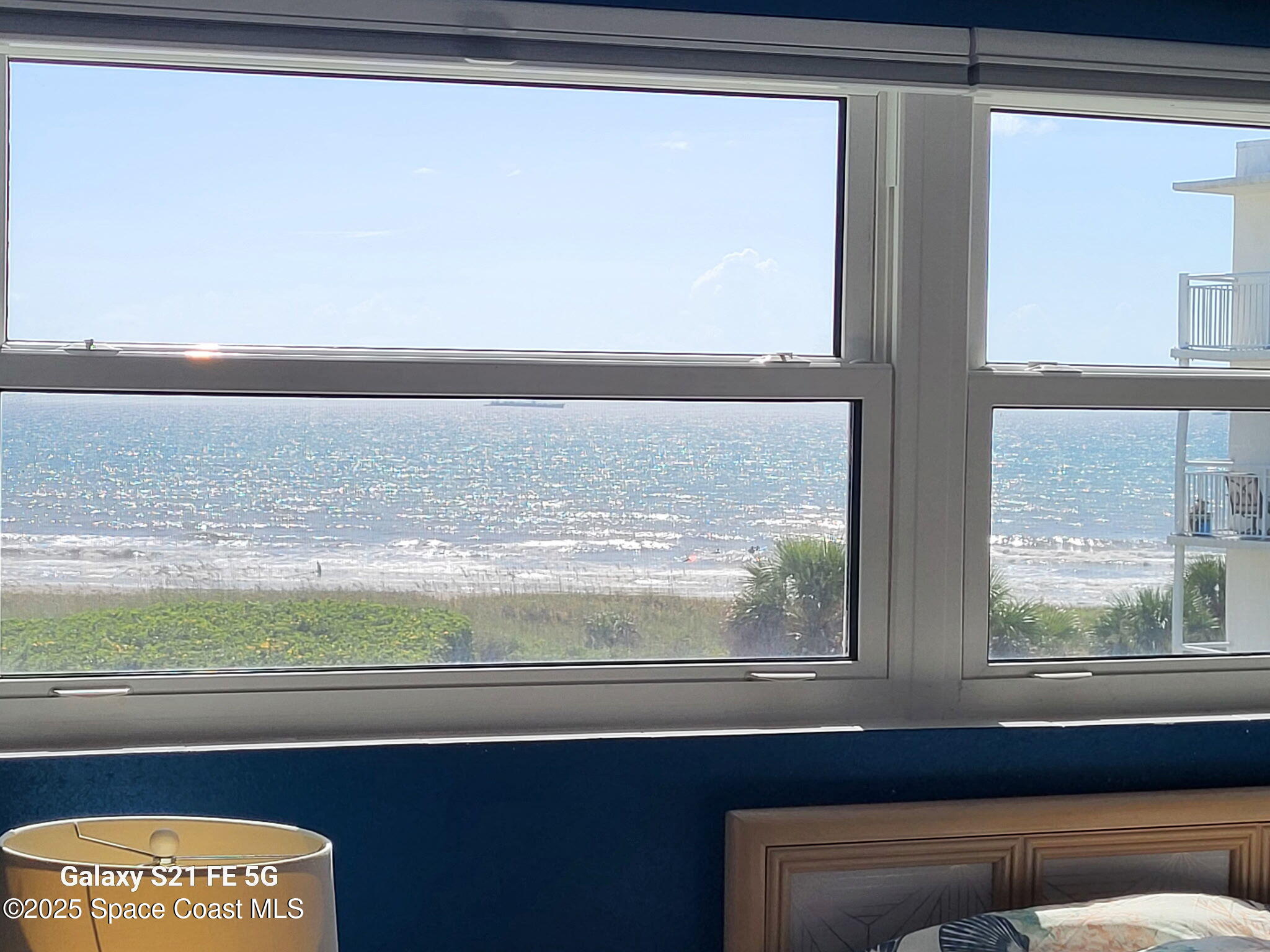 4000 Ocean Beach Boulevard, Unit 4F Cocoa Beach, FL 32931 - Photo 10 of 12 a close view of window cabinets and a floor to ceiling window