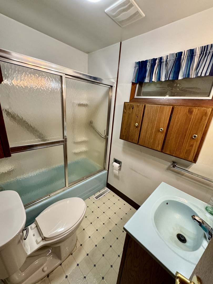 321 East North Street Sheffield, IL 61361 - Photo 15 of 26 a bathroom with a sink mirror vanity and toilet