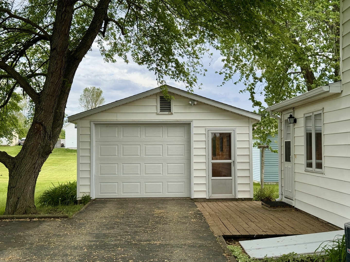 321 East North Street Sheffield, IL 61361 - Photo 24 of 26 a front view of a house with a yard and garage