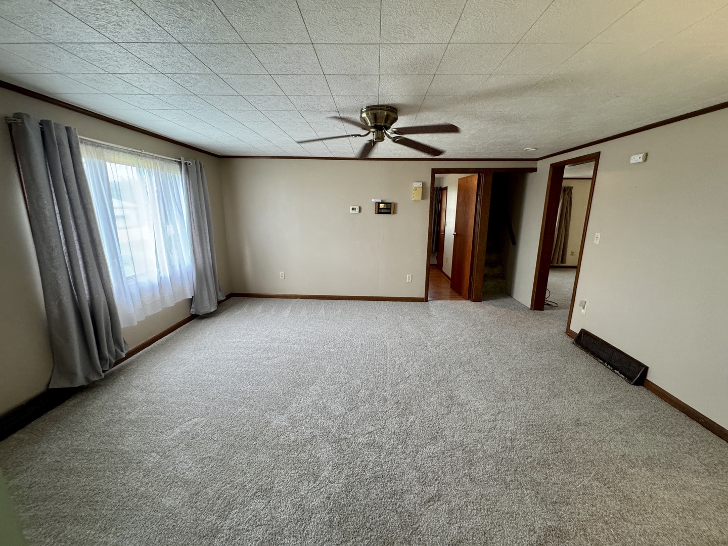 321 East North Street Sheffield, IL 61361 - Photo 4 of 26 a view of a livingroom with staircase and kitchen view