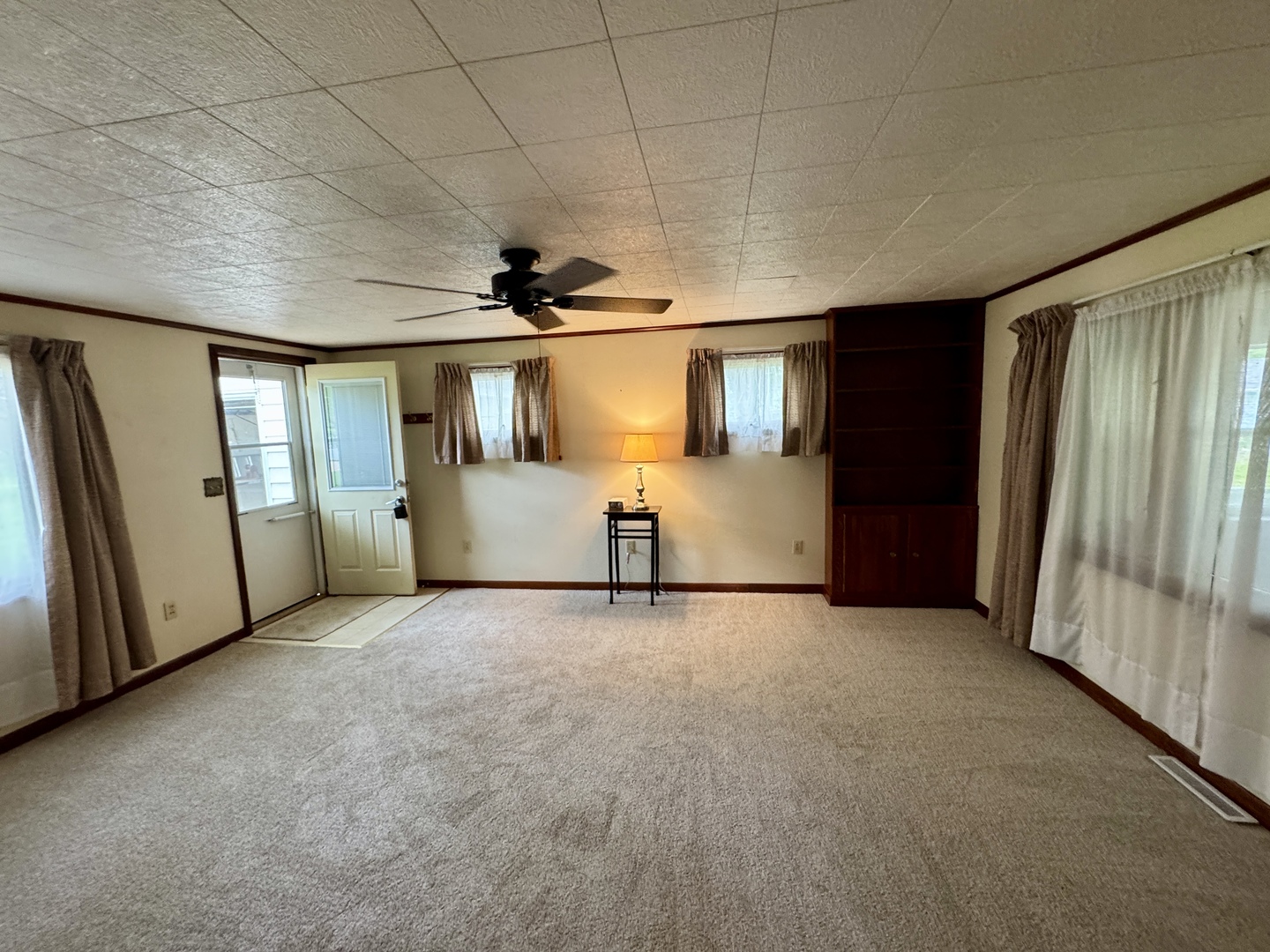 321 East North Street Sheffield, IL 61361 - Photo 5 of 26 a view of empty room with windows