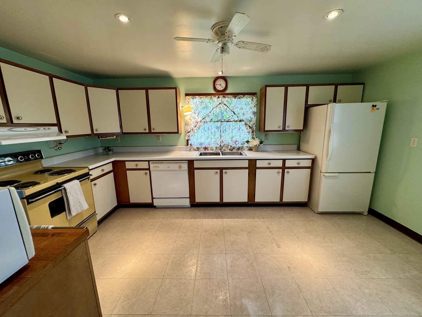 321 East North Street Sheffield, IL 61361 - Photo 7 of 26 a kitchen with stainless steel appliances granite countertop a sink and a refrigerator