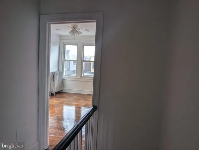 a view of a patio with dining table and chairs