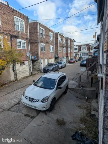 a kitchen with a refrigerator and a stove top oven