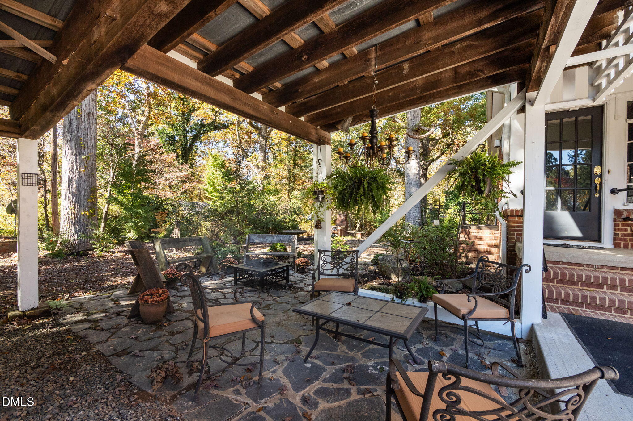 7891 Boston Road Roxboro, NC 27574 - Photo 59 of 94 a view of patio with table and chairs and potted plants