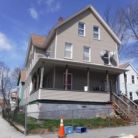 128 Austin Street Worcester, MA 01609 - Photo 2 of 2 a front view of a house with large windows