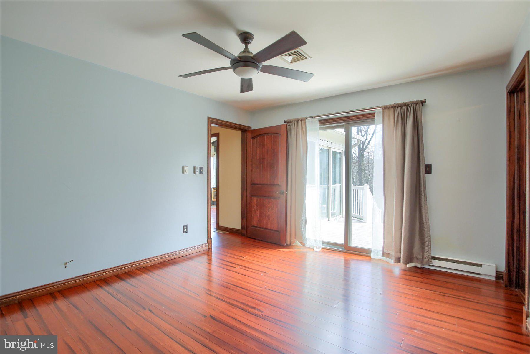 62 Tapeworm Road New Bloomfield, PA 17068 - Photo 18 of 40 Owners suite with slider to deck with hot tub.