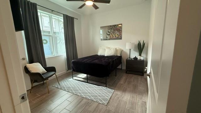 1353 Haywagon Tr. Loxahatchee, FL 33470 - Photo 13 of 34 a living room with a couch and a dresser next to a window