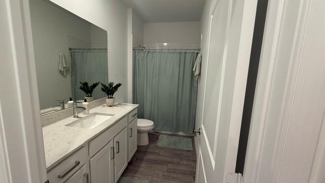 1353 Haywagon Tr. Loxahatchee, FL 33470 - Photo 14 of 34 a bathroom with a sink a toilet and shower